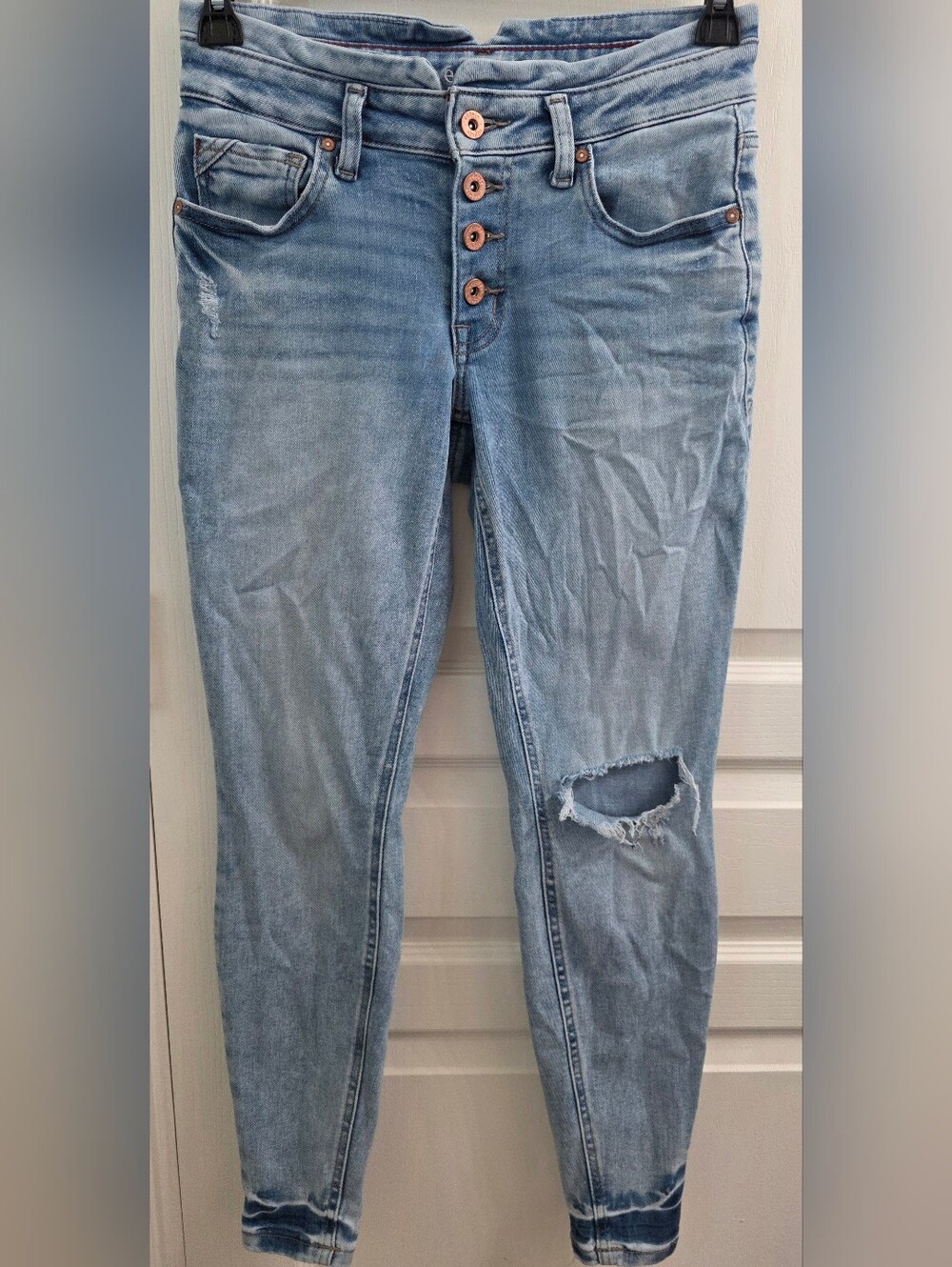 Women's Light Blue Distressed Skinny Jeans with Button-Fly